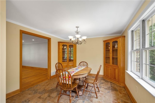511 Clubview Dr, Peters Twp, PA 15317 - dining area featuring stone finish floors, baseboards, a chandelier, healthy amount of natural light, and crown molding