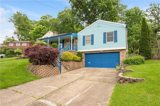 1064 Glen Oak Dr, Bethel Park, PA 15102 - view of front of property featuring a garage, covered porch, a front yard, stairway, and concrete driveway