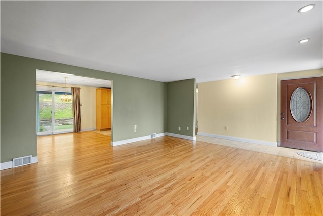 1064 Glen Oak Dr, Bethel Park, PA 15102 - unfurnished living room with light wood finished floors, recessed lighting, and a chandelier