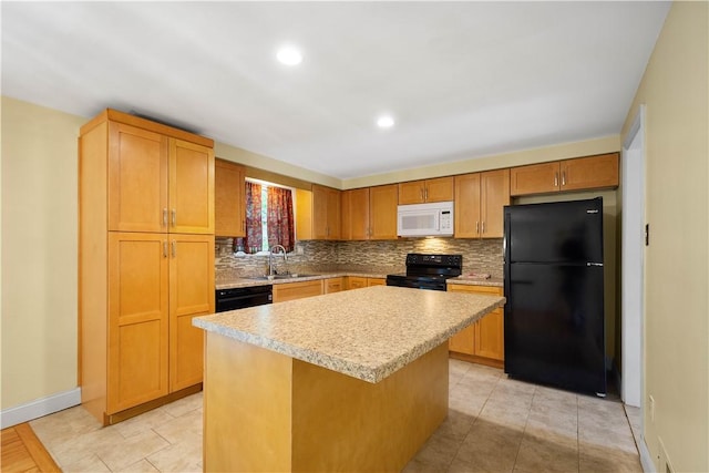 1064 Glen Oak Dr, Bethel Park, PA 15102 - kitchen with black appliances, light countertops, decorative backsplash, a kitchen island, and recessed lighting