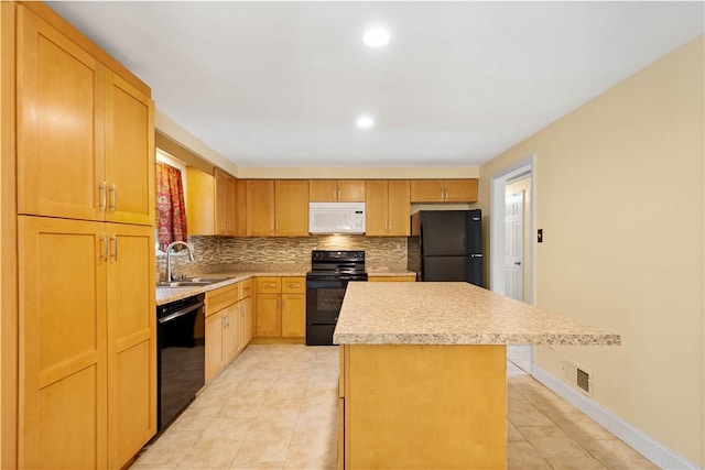 1064 Glen Oak Dr, Bethel Park, PA 15102 - kitchen featuring black appliances, a center island, tasteful backsplash, light countertops, and light tile patterned floors