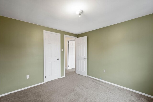 1064 Glen Oak Dr, Bethel Park, PA 15102 - unfurnished bedroom with baseboards and carpet floors