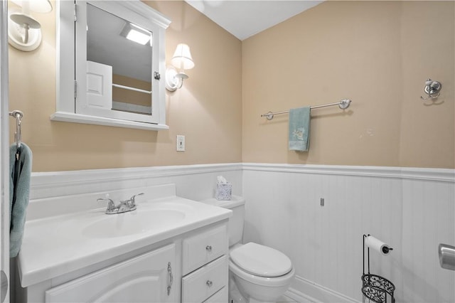 1064 Glen Oak Dr, Bethel Park, PA 15102 - bathroom featuring a wainscoted wall, toilet, and vanity