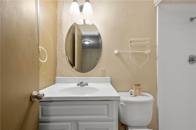 1064 Glen Oak Dr, Bethel Park, PA 15102 - bathroom with vanity, toilet, and a textured wall