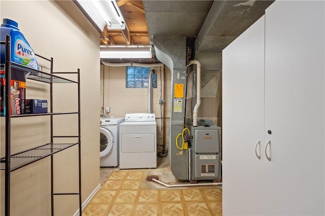 1064 Glen Oak Dr, Bethel Park, PA 15102 - laundry area featuring washing machine and clothes dryer, heating unit, and light floors