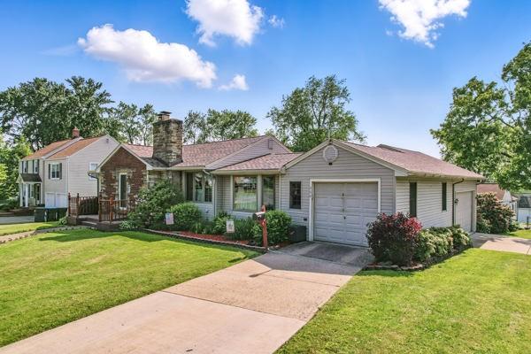 260 S Oakdale Ave, Hermitage, PA 16148 - ranch-style home with a garage, a chimney, driveway, and a front lawn