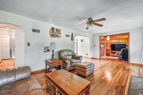 260 S Oakdale Ave, Hermitage, PA 16148 - living area with arched walkways, a ceiling fan, and light wood-type flooring