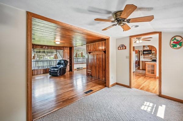 260 S Oakdale Ave, Hermitage, PA 16148 - hallway with light wood-type flooring, light carpet, baseboards, and vaulted ceiling