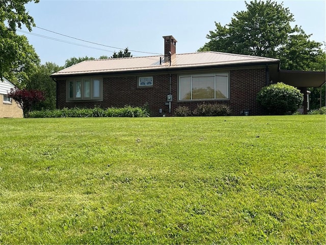 2617 S Hermitage Rd, Hermitage, PA 16148 - back of house featuring brick siding, a lawn, and metal roof