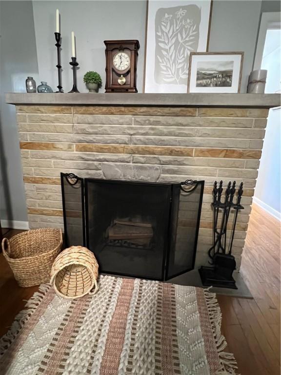2617 S Hermitage Rd, Hermitage, PA 16148 - detailed view of wood finished floors, a fireplace, and baseboards