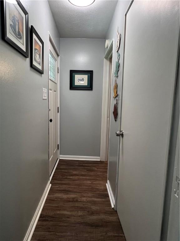 2617 S Hermitage Rd, Hermitage, PA 16148 - hall featuring dark wood-style flooring, baseboards, and a textured ceiling