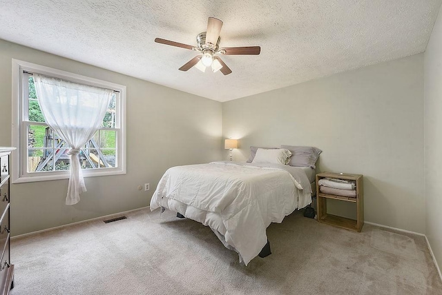 504 Diablo Dr, Bethel Park, PA 15102 - bedroom with a textured ceiling, light colored carpet, baseboards, and a ceiling fan