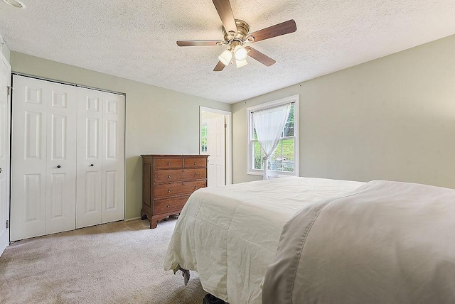 504 Diablo Dr, Bethel Park, PA 15102 - bedroom featuring light colored carpet, a textured ceiling, a closet, and a ceiling fan