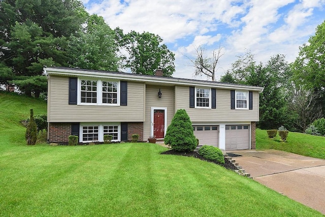 504 Diablo Dr, Bethel Park, PA 15102 - bi-level home featuring driveway, a garage, brick siding, a front lawn, and a chimney