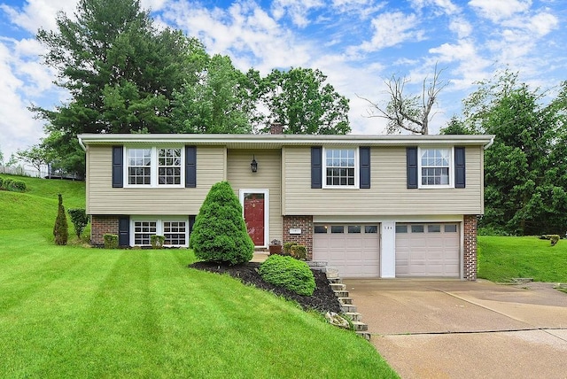 504 Diablo Dr, Bethel Park, PA 15102 - bi-level home with driveway, an attached garage, brick siding, and a front yard