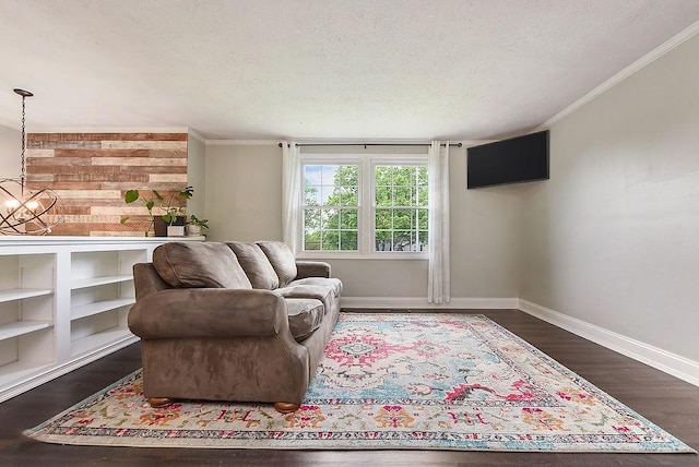 504 Diablo Dr, Bethel Park, PA 15102 - living area featuring a textured ceiling, baseboards, a chandelier, dark wood finished floors, and ornamental molding