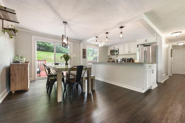 504 Diablo Dr, Bethel Park, PA 15102 - dining room with a textured ceiling, a chandelier, dark wood-style flooring, crown molding, and baseboards