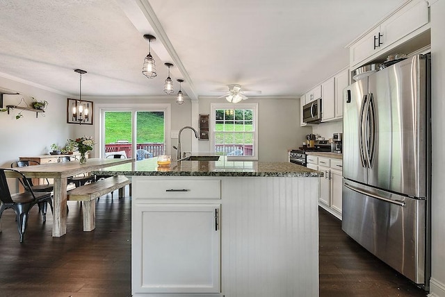 504 Diablo Dr, Bethel Park, PA 15102 - kitchen featuring stainless steel appliances, a sink, ceiling fan, dark wood finished floors, and crown molding
