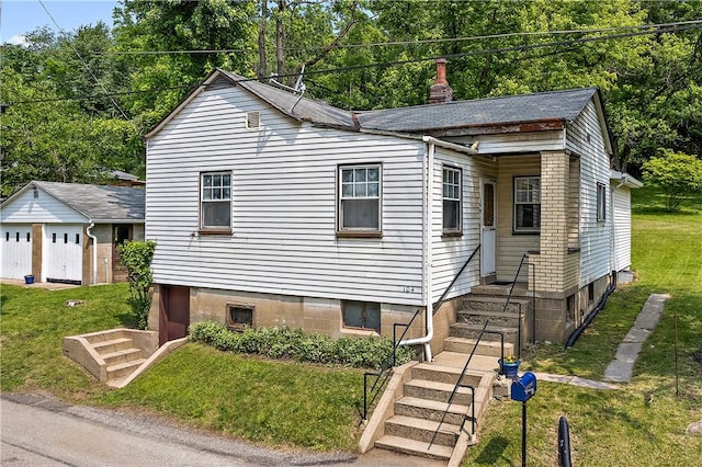 104 W Rd, Shaler, PA 15209 - view of front of home featuring a front yard and a chimney
