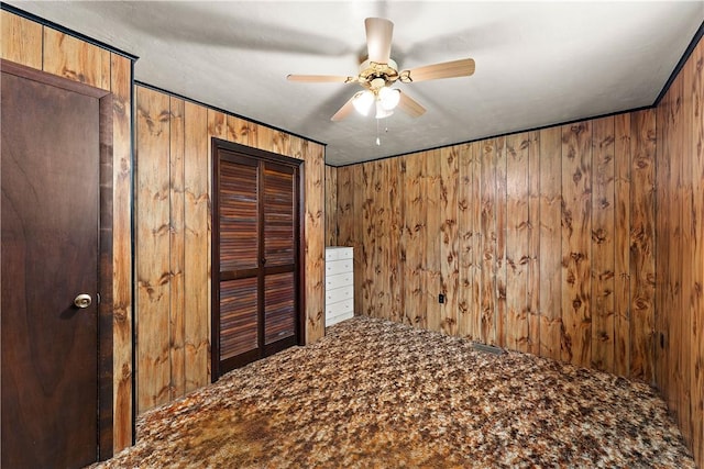 104 W Rd, Shaler, PA 15209 - unfurnished bedroom featuring wood walls, carpet floors, and ceiling fan