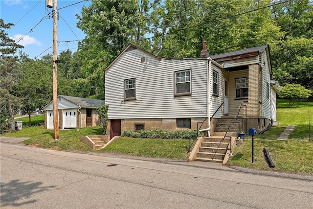 104 W Rd, Shaler, PA 15209 - view of front of house with a chimney, an outdoor structure, a front yard, and stairs
