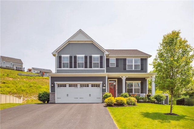 121 Derby Ln, North Fayette, PA 15071 - view of front of home featuring an attached garage, driveway, and board and batten siding