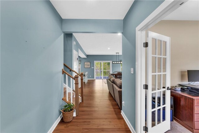 121 Derby Ln, North Fayette, PA 15071 - hallway featuring wood finished floors, stairs, and baseboards