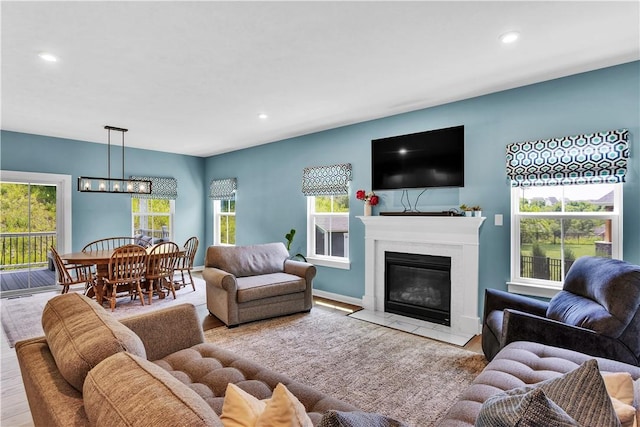121 Derby Ln, North Fayette, PA 15071 - living room featuring healthy amount of natural light, recessed lighting, wood finished floors, and a fireplace