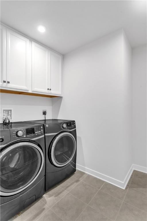 121 Derby Ln, North Fayette, PA 15071 - washroom featuring cabinet space, separate washer and dryer, baseboards, and light tile patterned floors