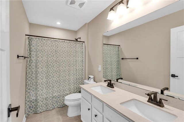 121 Derby Ln, North Fayette, PA 15071 - full bathroom with tile patterned floors, double vanity, toilet, and a shower with shower curtain