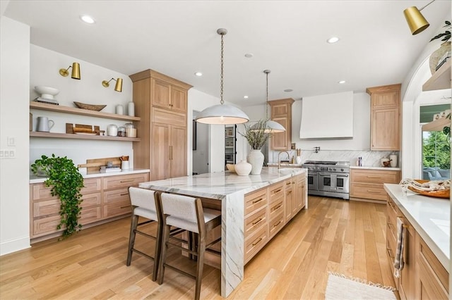 506 Ridge Ct, Pine Twp Nal, PA 15090 - kitchen with range with two ovens, custom exhaust hood, light brown cabinetry, light wood-style flooring, and recessed lighting