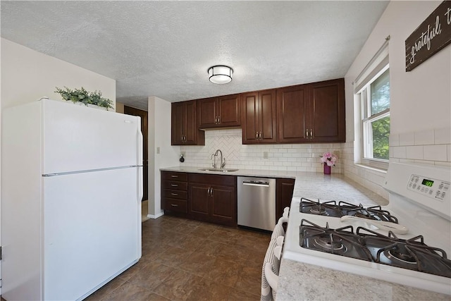 119 Summit Ridge Dr, Bridgeville, PA 15017 - kitchen with white appliances, a sink, light countertops, tasteful backsplash, and dark brown cabinets