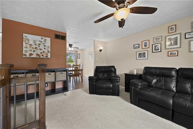 119 Summit Ridge Dr, Bridgeville, PA 15017 - carpeted living room with ceiling fan, a textured ceiling, and baseboards