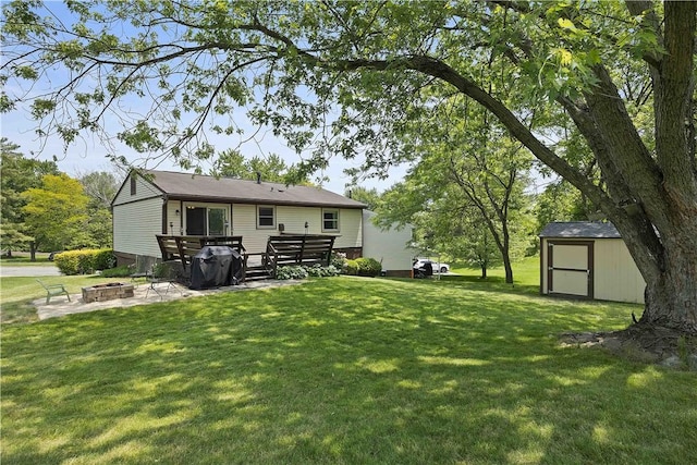 119 Summit Ridge Dr, Bridgeville, PA 15017 - back of house featuring an outdoor fire pit, a yard, and a wooden deck