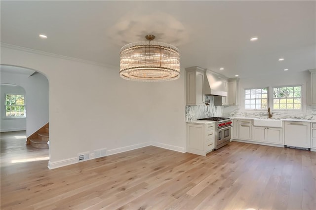 129 S Dr, Fox Chapel, PA 15238 - kitchen with double oven range, dishwasher, custom range hood, a sink, and plenty of natural light