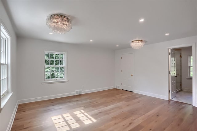 129 S Dr, Fox Chapel, PA 15238 - unfurnished room with a chandelier, light wood-style floors, plenty of natural light, and recessed lighting