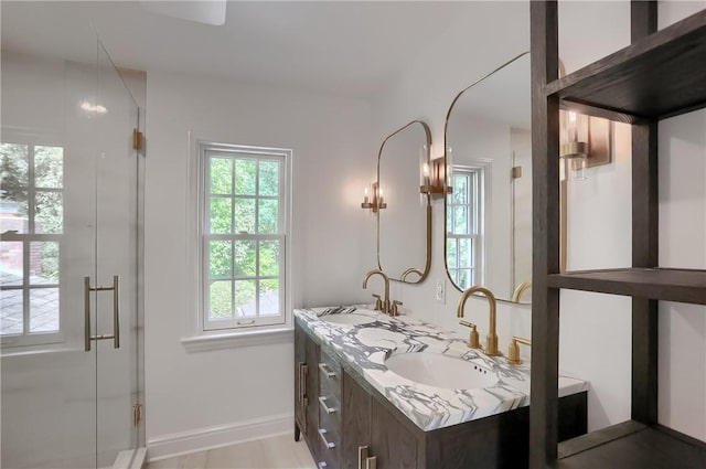 129 S Dr, Fox Chapel, PA 15238 - bathroom featuring double vanity, a stall shower, and baseboards
