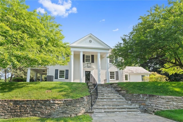 129 S Dr, Fox Chapel, PA 15238 - neoclassical / greek revival house featuring stucco siding, a front yard, and stairs