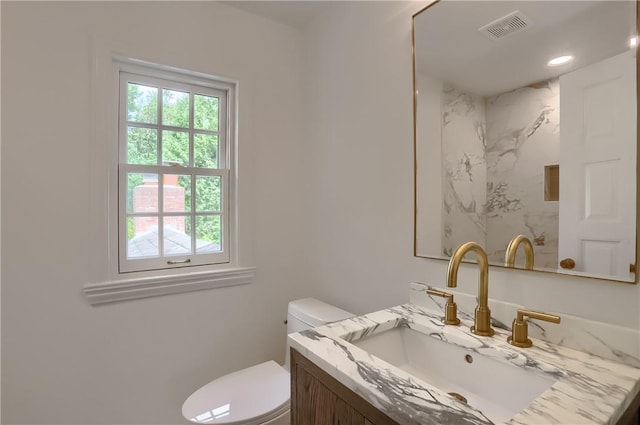 129 S Dr, Fox Chapel, PA 15238 - bathroom featuring healthy amount of natural light, vanity, toilet, recessed lighting, and a shower
