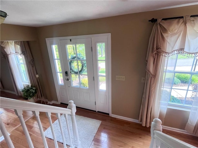 138 Willow Run Dr, Center Twp But, PA 16001 - foyer entrance with healthy amount of natural light, light wood-style flooring, and baseboards