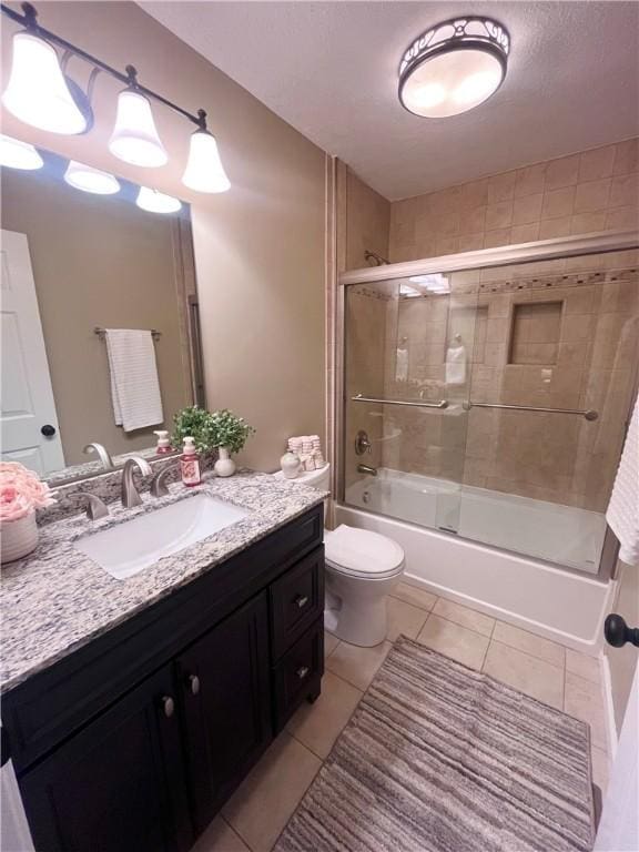 138 Willow Run Dr, Center Twp But, PA 16001 - full bath with vanity, tile patterned flooring, toilet, and bath / shower combo with glass door