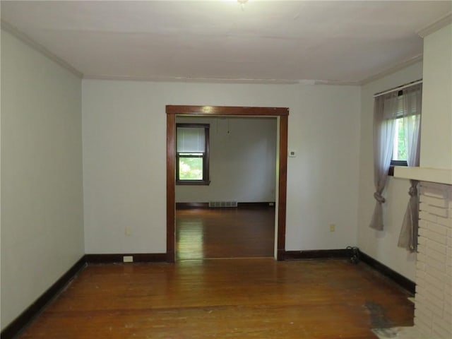 1111 Progress St, Mckees Rocks, PA 15136 - empty room with ornamental molding, wood finished floors, and baseboards