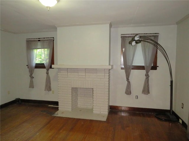 1111 Progress St, Mckees Rocks, PA 15136 - unfurnished living room with ornamental molding, wood finished floors, a fireplace, and baseboards