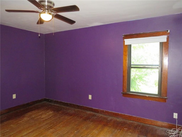 1111 Progress St, Mckees Rocks, PA 15136 - unfurnished room with plenty of natural light, dark wood finished floors, baseboards, and a ceiling fan