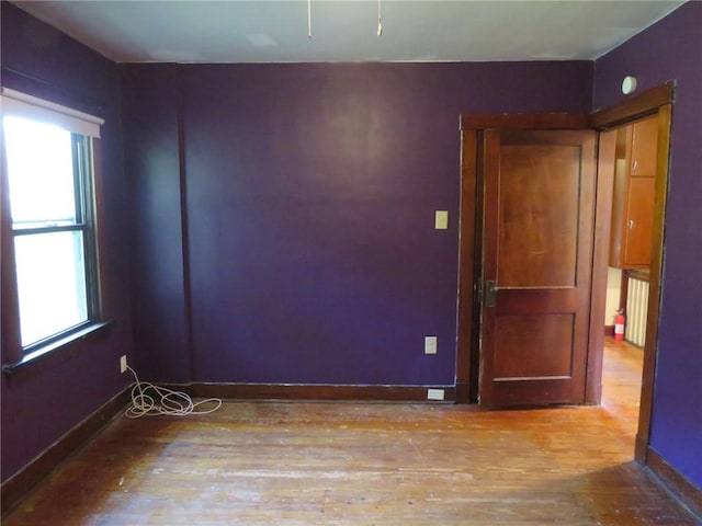 1111 Progress St, Mckees Rocks, PA 15136 - empty room with wood finished floors and baseboards