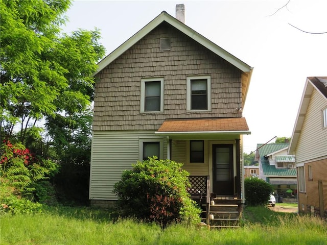 1111 Progress St, Mckees Rocks, PA 15136 - back of house featuring a porch and a chimney