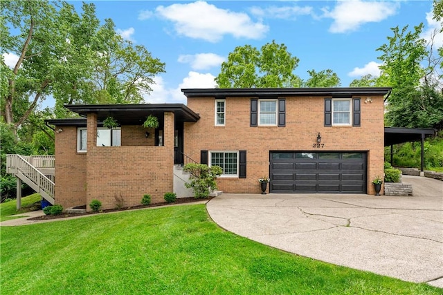 227 Shady Knoll Dr, Scott Twp Sal, PA 15220 - tri-level home with a garage, concrete driveway, and brick siding