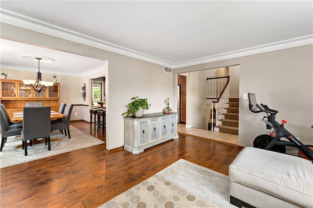 227 Shady Knoll Dr, Scott Twp Sal, PA 15220 - living room featuring hardwood / wood-style floors, a chandelier, stairs, ornamental molding, and baseboards