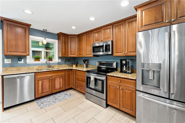 227 Shady Knoll Dr, Scott Twp Sal, PA 15220 - kitchen featuring appliances with stainless steel finishes, a sink, brown cabinetry, light stone counters, and recessed lighting