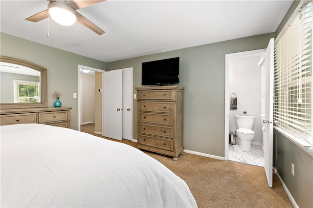 227 Shady Knoll Dr, Scott Twp Sal, PA 15220 - bedroom featuring ensuite bath, baseboards, a ceiling fan, and light carpet